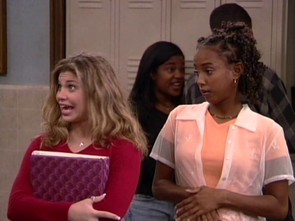 Topanga holds a binder and Angela looks over her shoulder in &quot;Boy Meets World&quot;