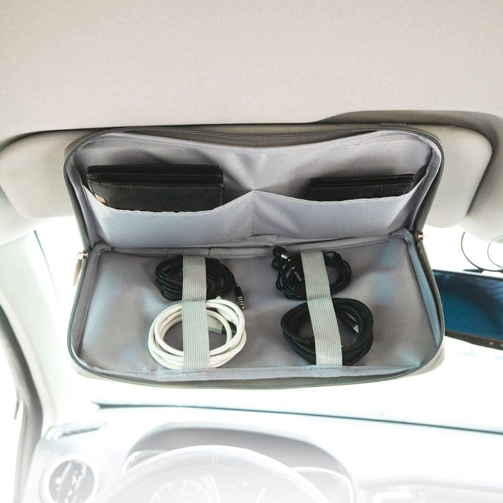 the interior zipper pocket of the organizer with cords and other items
