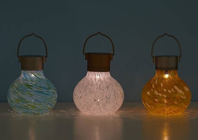 Three solar tealights in mint, snow, and saffron
