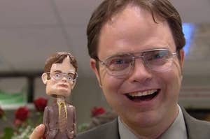 Dwight posing with his bobble head