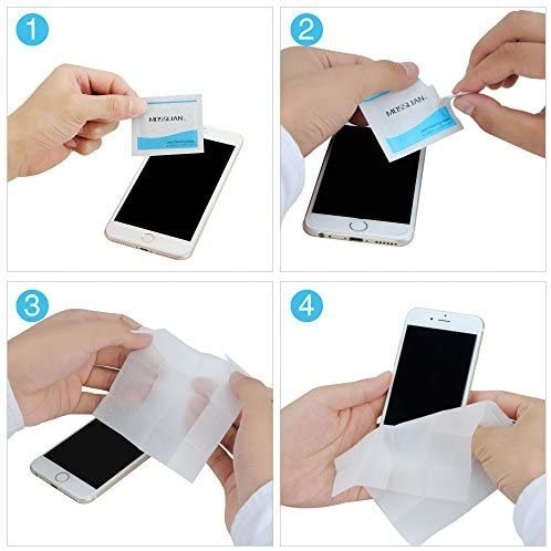 A person taking the wipe out of its sachet and cleaning a phone with it