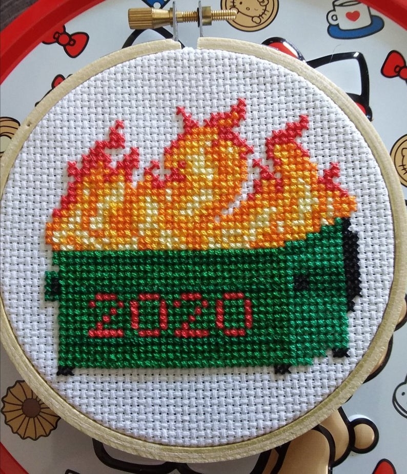 An embroidered dumpster on fire that says 2020