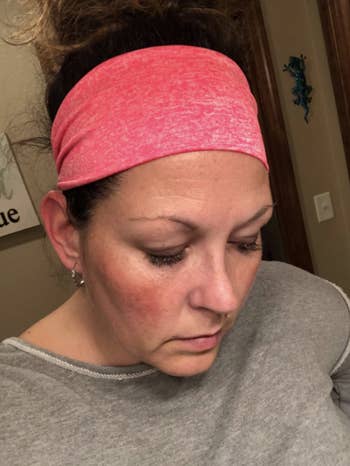 a reviewer wearing the headband in pink