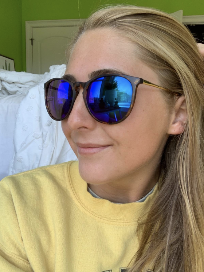 A reviewer in the blue-tinted sunglasses