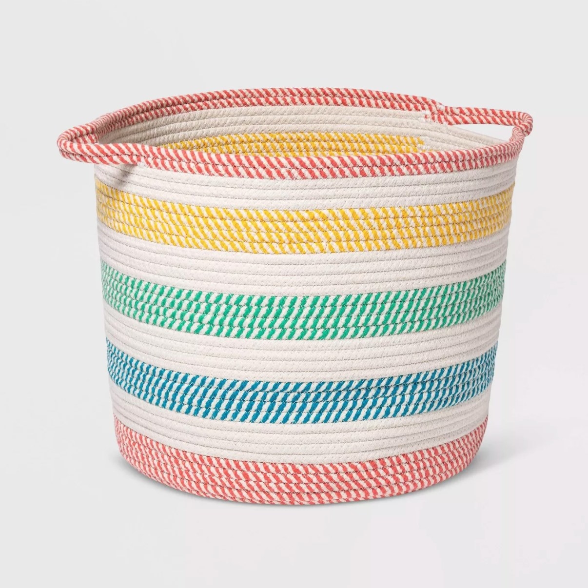 A white rope basket with rainbow-colored stripes