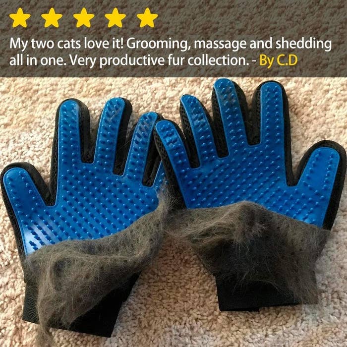 A pair of grooming gloves with a significant amount of pet half-peeled off of them