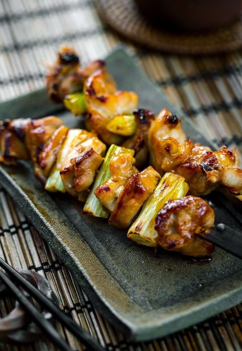Grilled skewers of chicken thighs and scallions.