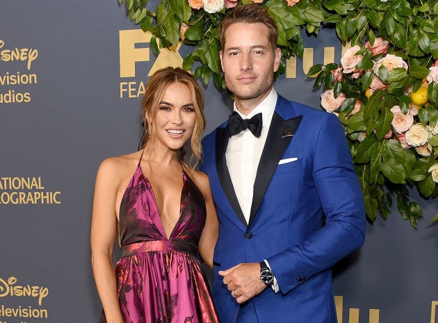 A red carpet photo of Chrishell and Justin.