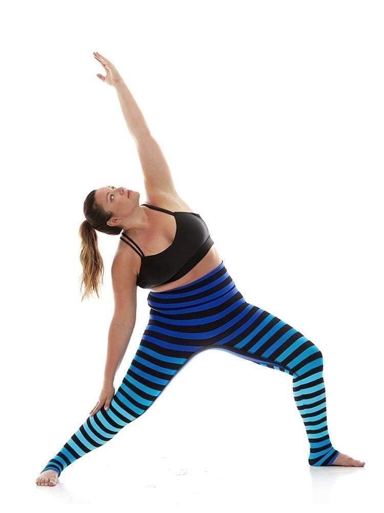 Model wearing the blue ombre striped leggings while doing a yoga pose