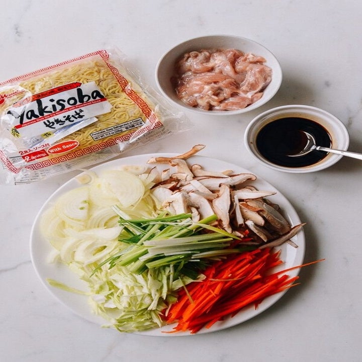Yakisoba ingredients included yakisoba noodles, marinated chicken, and thinly sliced vegetables.
