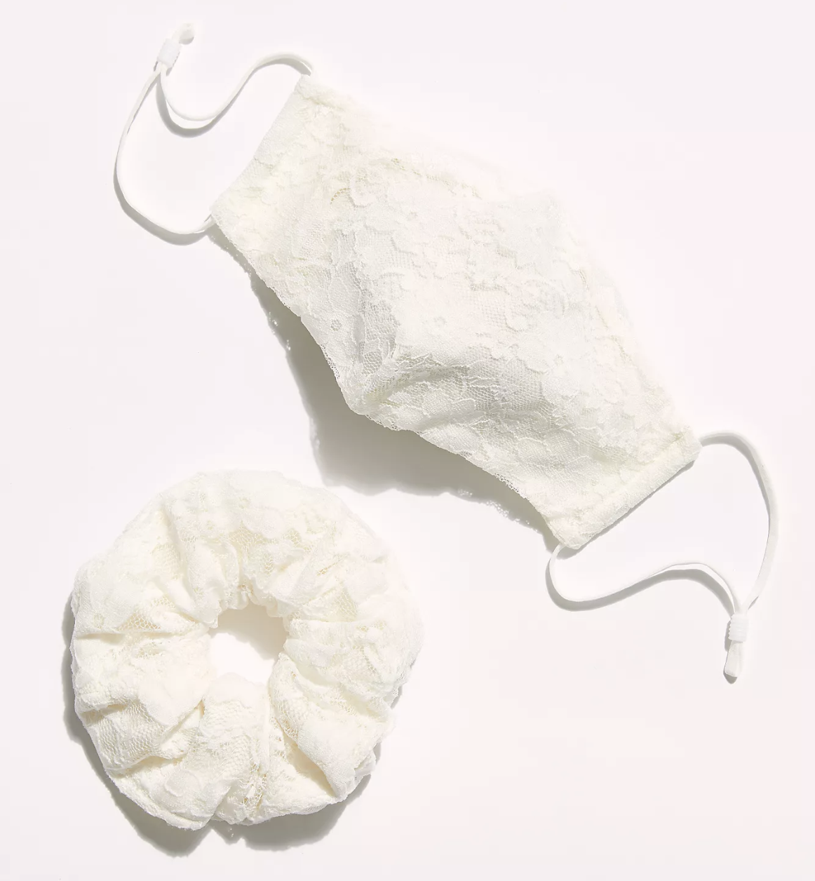A white lace face mask and scrunchie