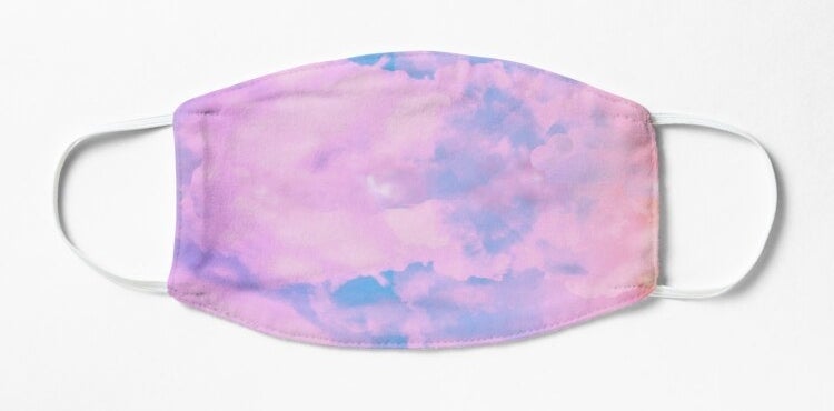 A pink and blue sky pattern on a mask 