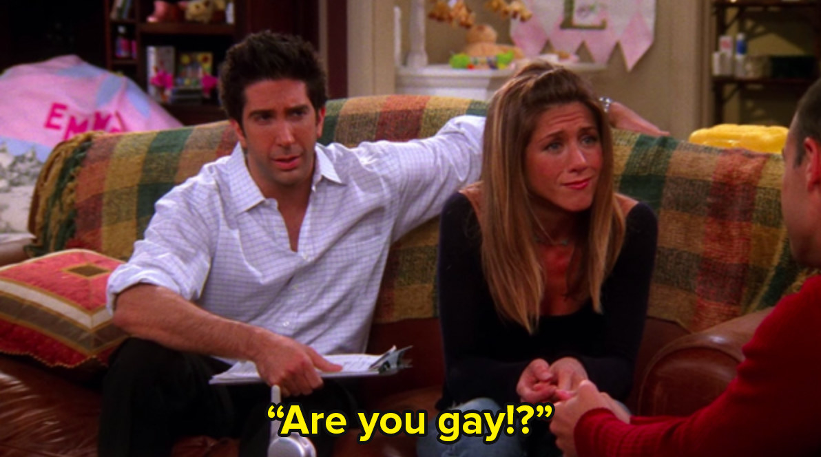 Ross and Rachel from Friends sit on a couch and Ross says are you gay to an unseen figure