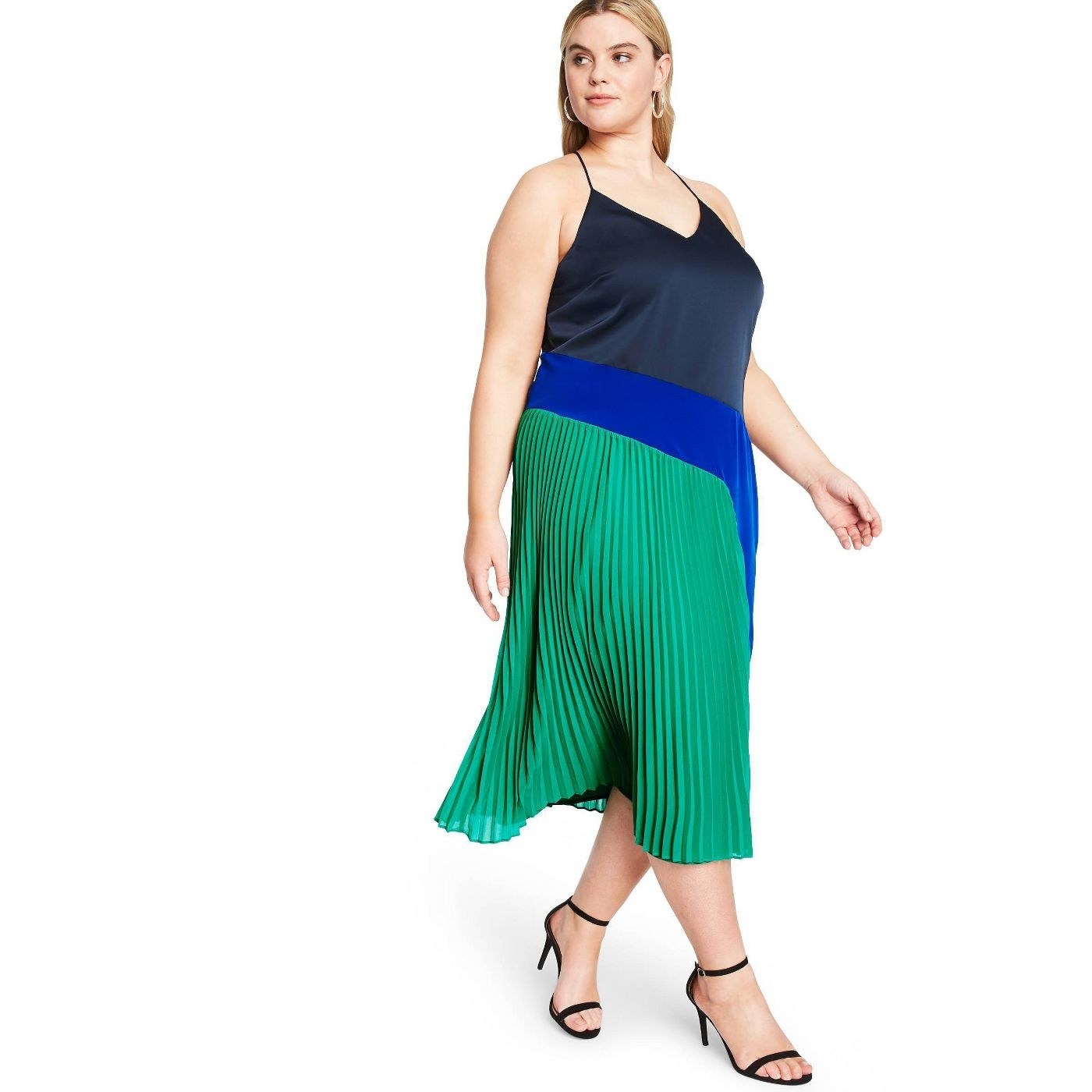 model wearing pleated tank dress with green, blue, and black colorblock