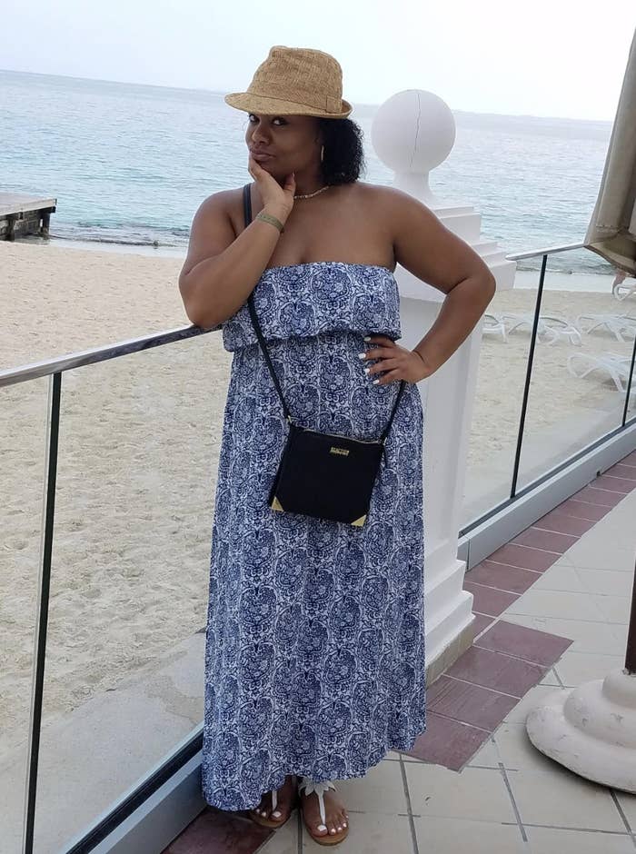 reviewer wearing strapless porcelain print dress at the beach 