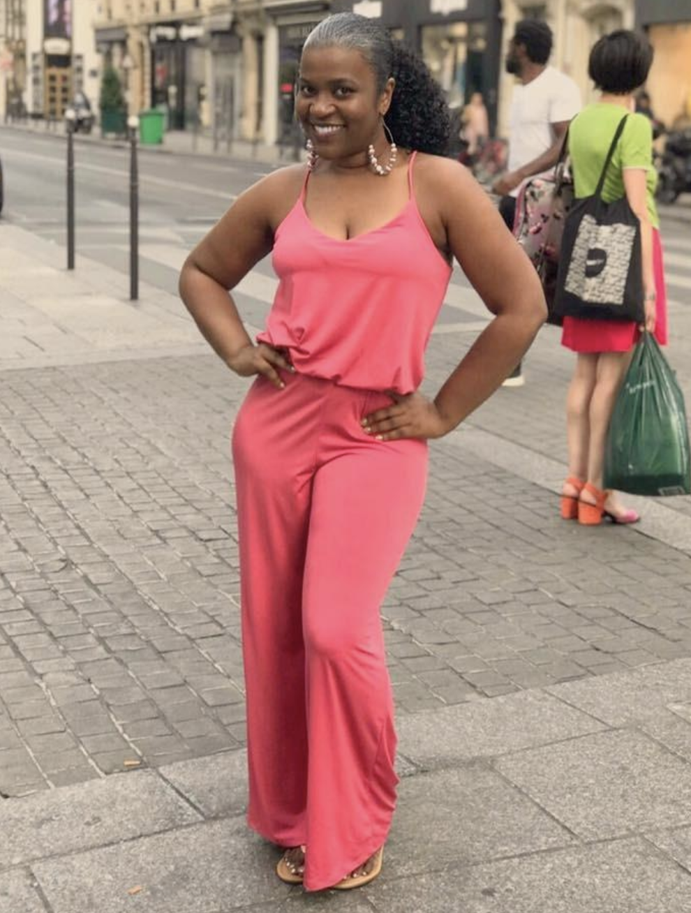 reviewer wearing V-neck tank jumpsuit with wide leg design in hot pink