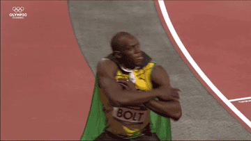 Usain Bolt posing after winning the 100m for the second time in 2012