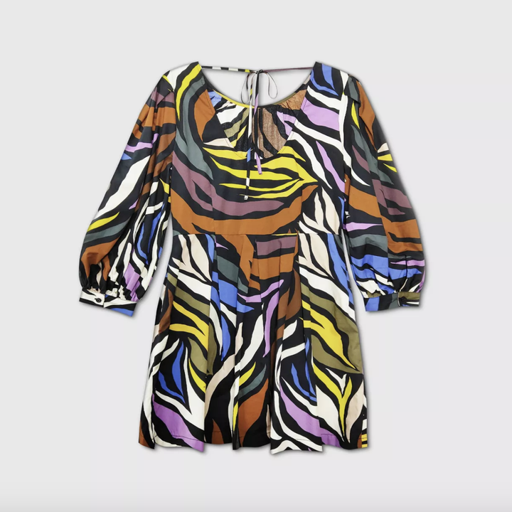 the dress with a small V-neck cutout in the back 