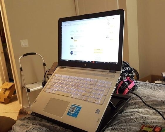 Reviewer&#x27;s picture of their laptop on the lap desk while in bed