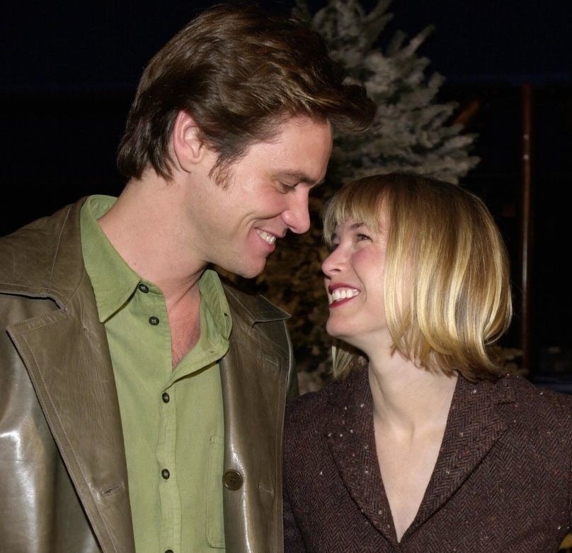 A red carpet photo of Jim Carrey and Renée Zellweger.