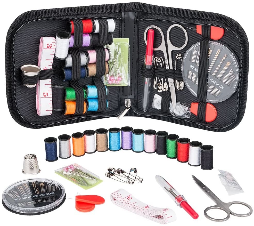 The sewing kit including threads and tools inside