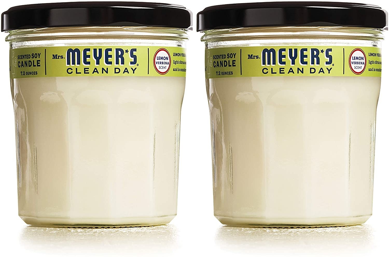 Two white Mrs. Meyer's Clean Day candles
