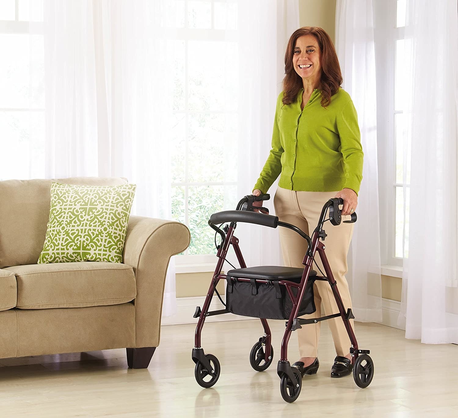 person using the walker to walk across a living room. 