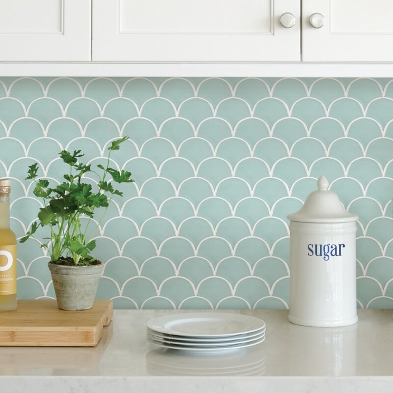 The light blue tile with a scalloped pattern outlined in white