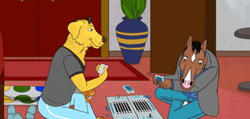 A GIF of Bojack flipping a board game on Mr. Peanutbutter