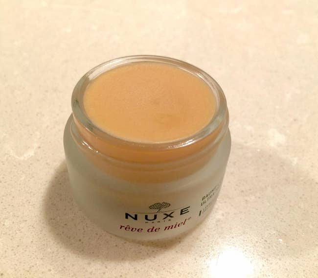 Reviewer photo of the lip balm, which comes in a small pot