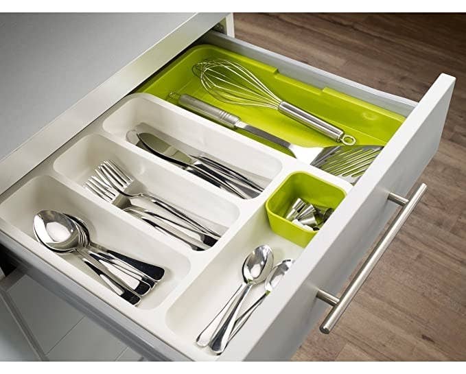 Spoons, forks and knives arranged in the cutlery organiser.