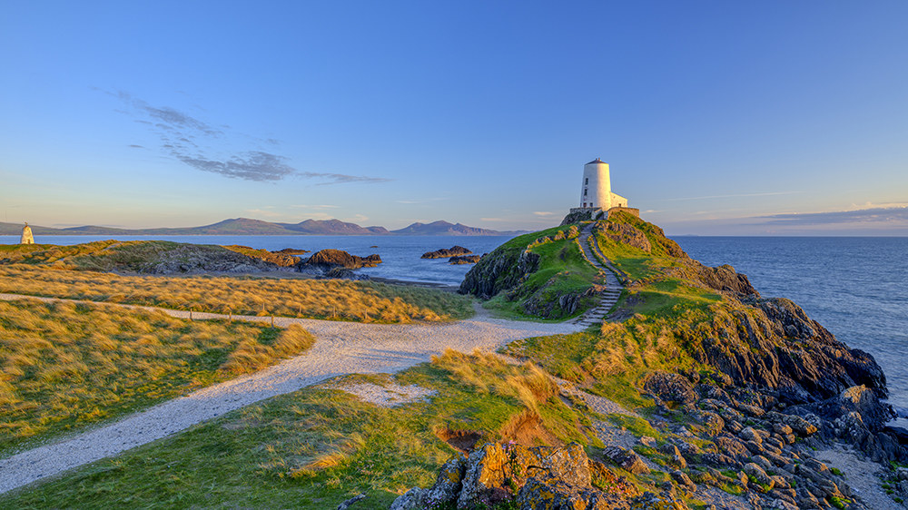 The lighthouse sits on a small hill on the island 