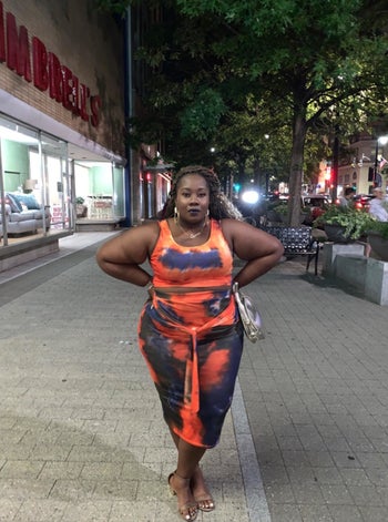 Another reviewer wearing the same set but in orange and purple tie-dye