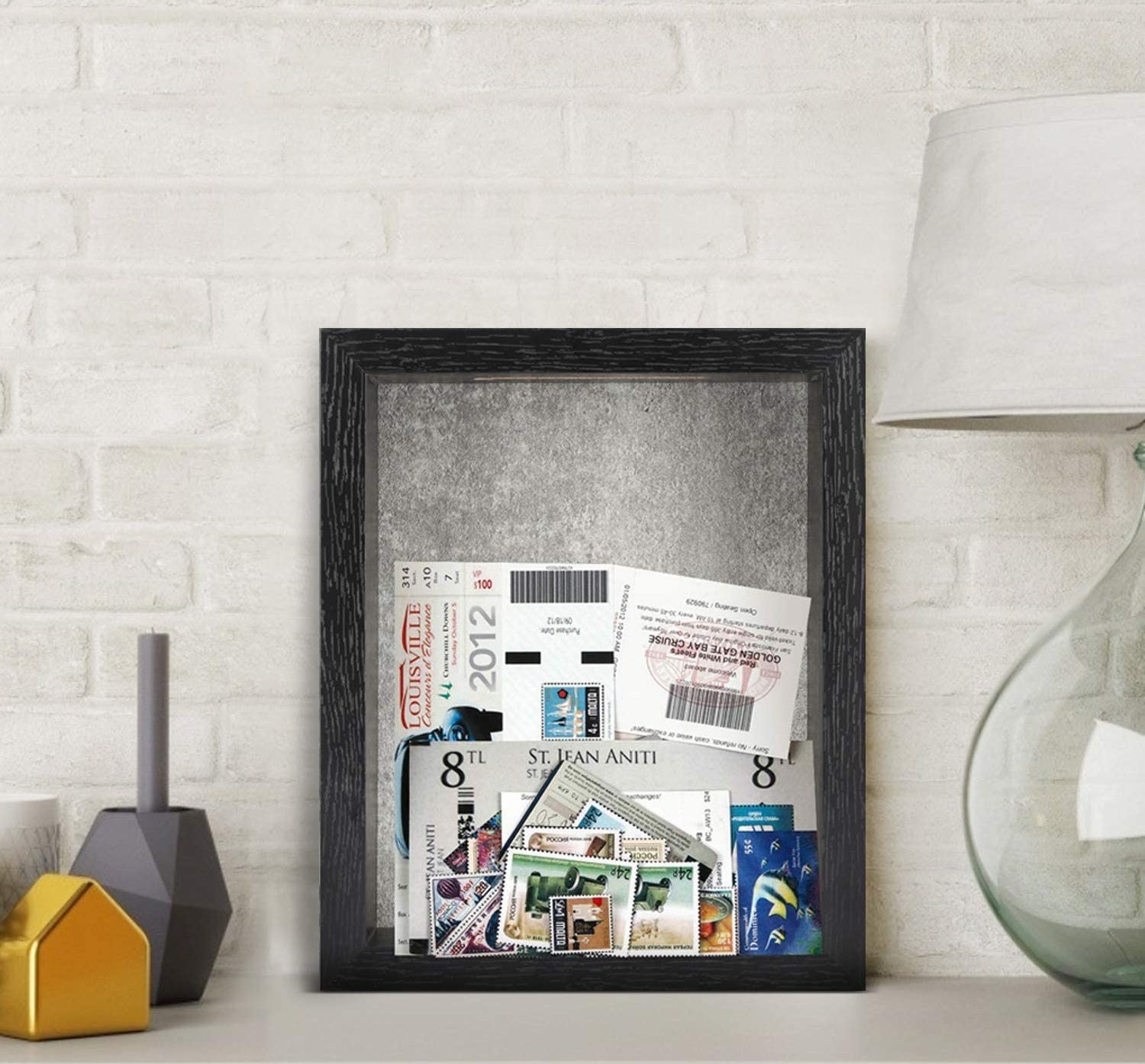The shadow box perched on a sideboard and filled with ticket stubs and photographs