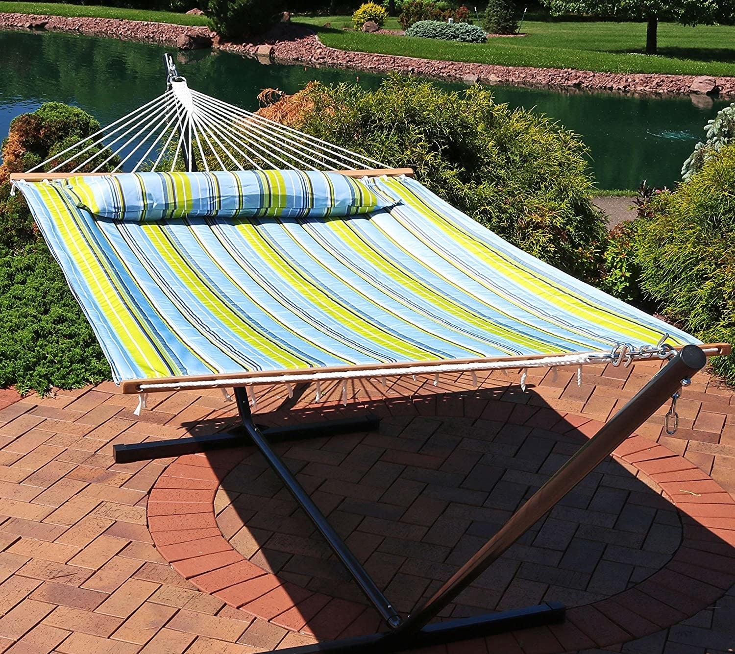 A hammock hangs on a patio