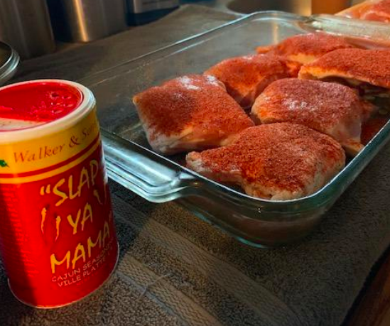 A customer review photo of a baking dish filled with chicken covered in Slap Ya Mama Louisiana Style Cajun Seasoning