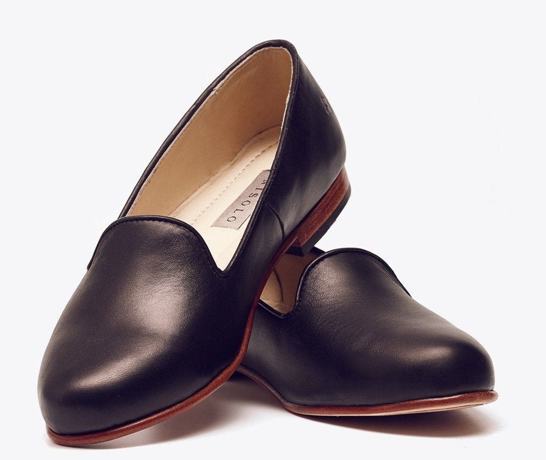 pair of black leather smoking slipper flats with rich brown bases 