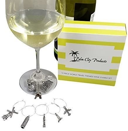 A wine glass with charms of famous landmarks