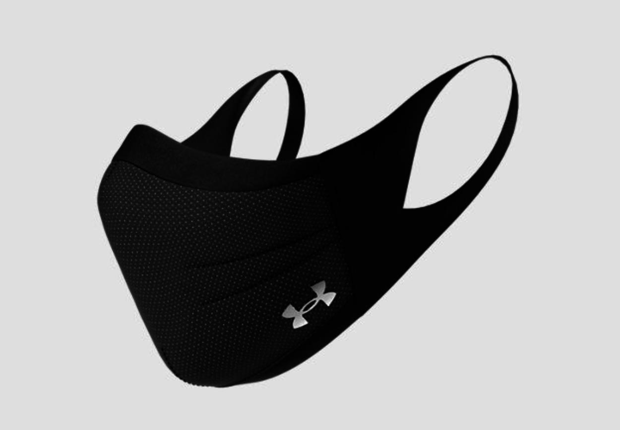 A gray mask with the under armour logo on the bottom side 