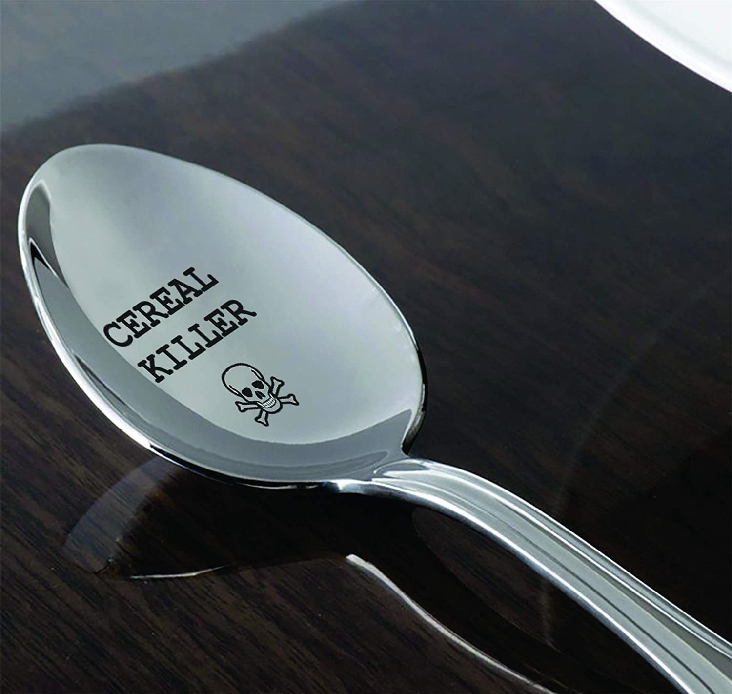 A steel spoon that reads &quot;cereal killer&quot;