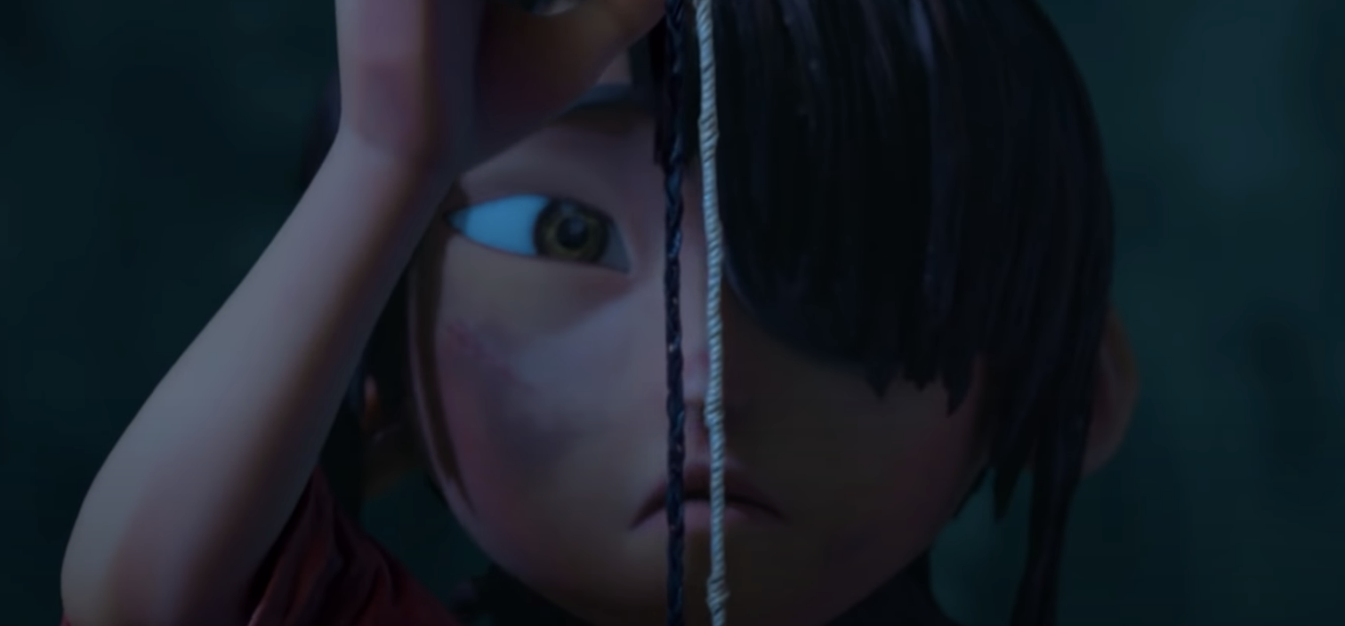 Kubo looking at the strings he had around his wrist