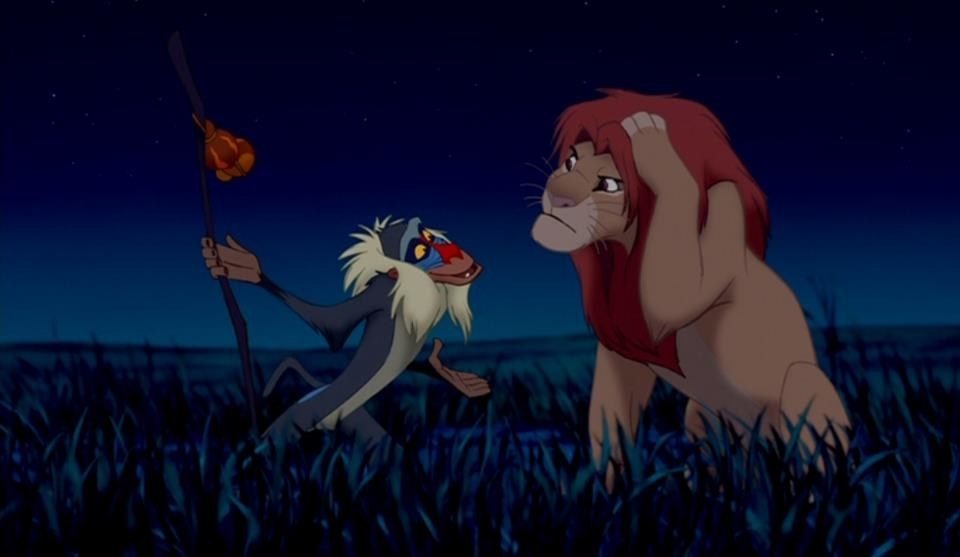 Rafiki hitting Simba on the head