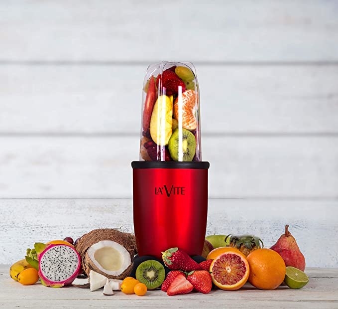 The blender jar filled with fruits