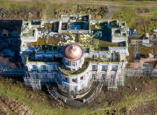 aerial view of mansion with scaffolding