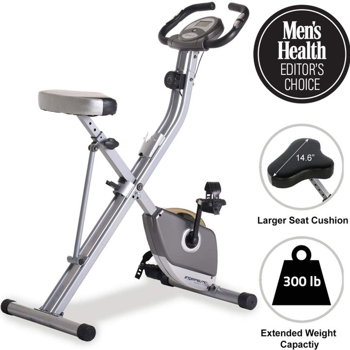 The silvery bike, with text "Men's Health editor's choice" larger seat cushion, 300 pound extended weight capacity