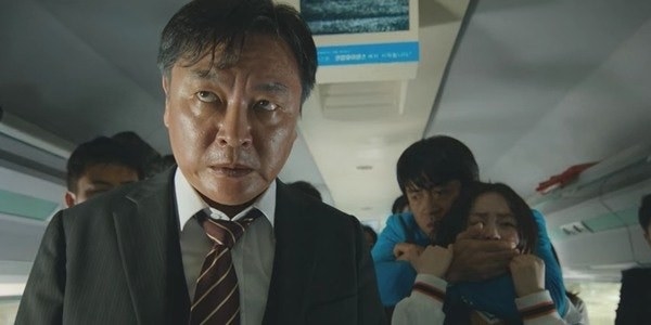 Yon-suk worn out and stressed while taking everyone hostage on the bus