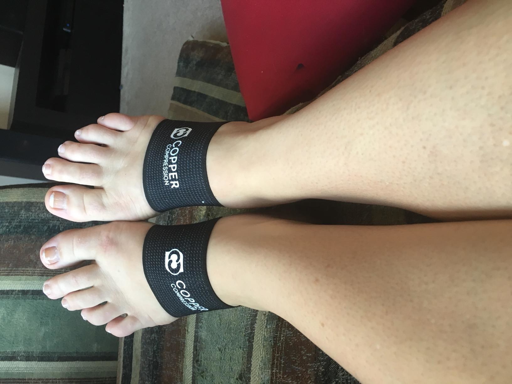 A reviewer&#x27;s feet with the bands on