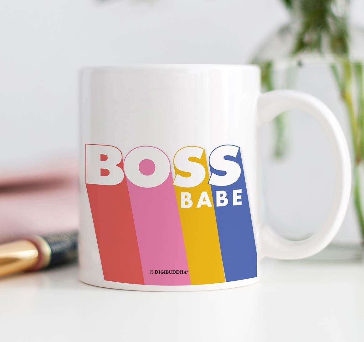 a colorful mug that says &quot;boss babe&quot; on it