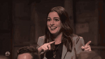 A gif of Anne Hathaway making a mind blown gesture.