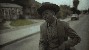 Lil Nas X waves his finger
